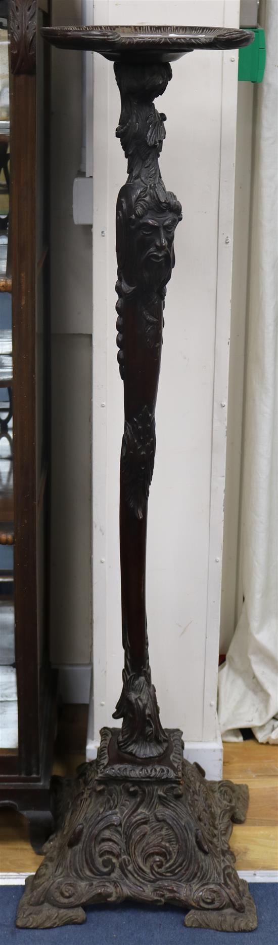 A carved mahogany torchere stand W.40cm
